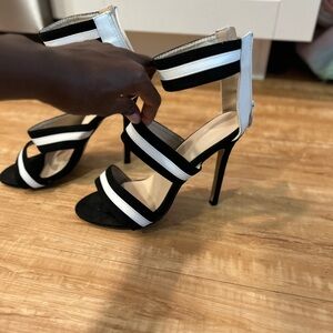 Black and white heeled sandals for women.